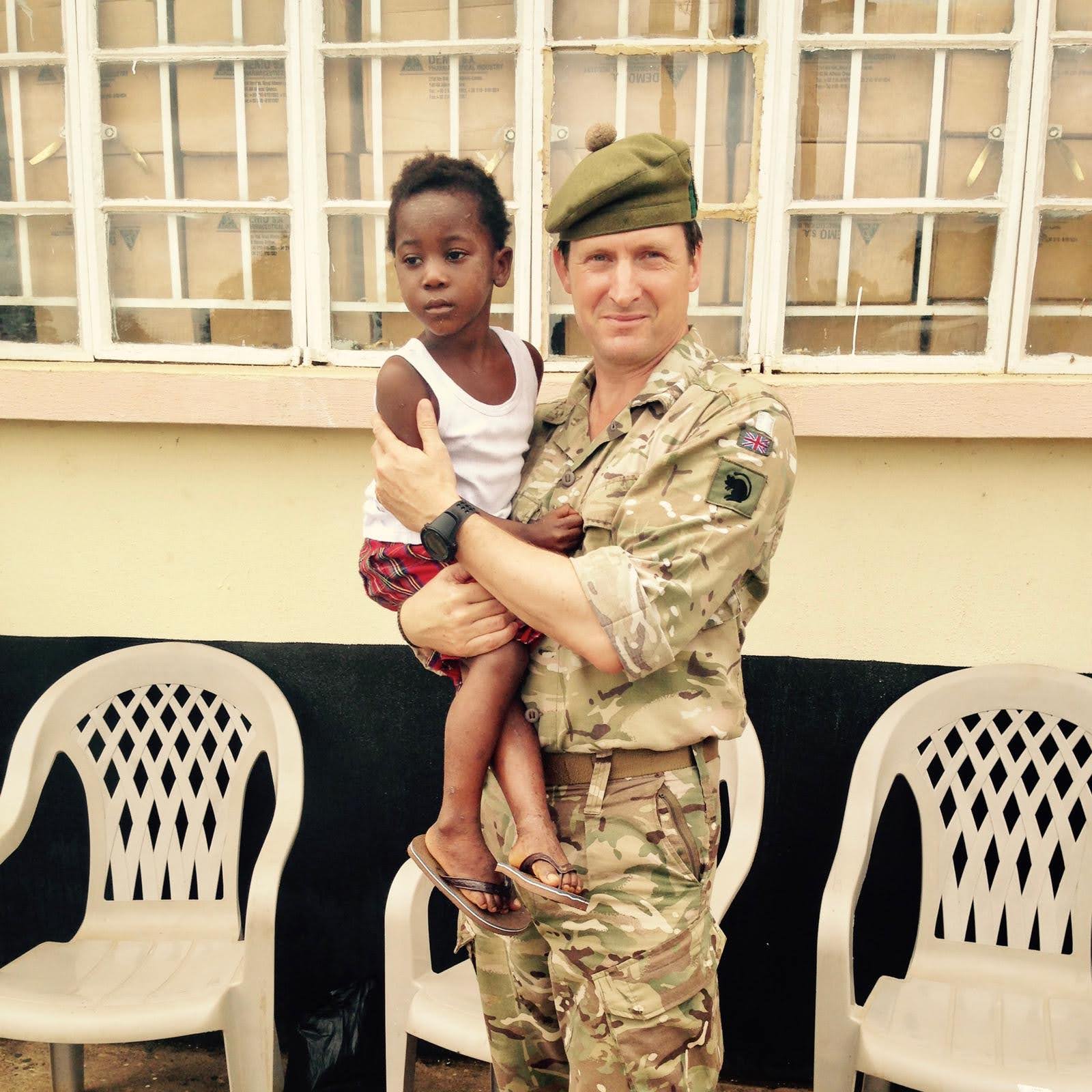 Maj Gen (Retd) Herbert with Child in Sierra Leone